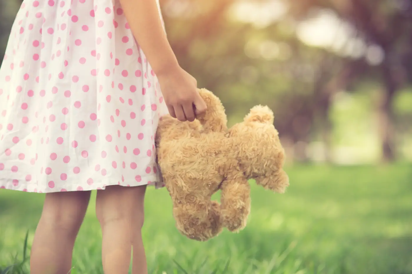 Child holding teddy