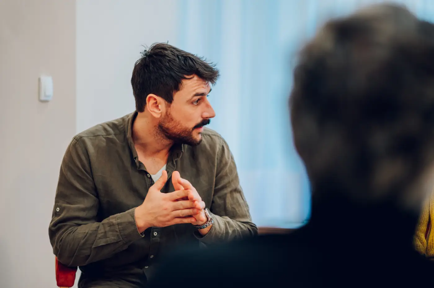 Anxious man in counselling session