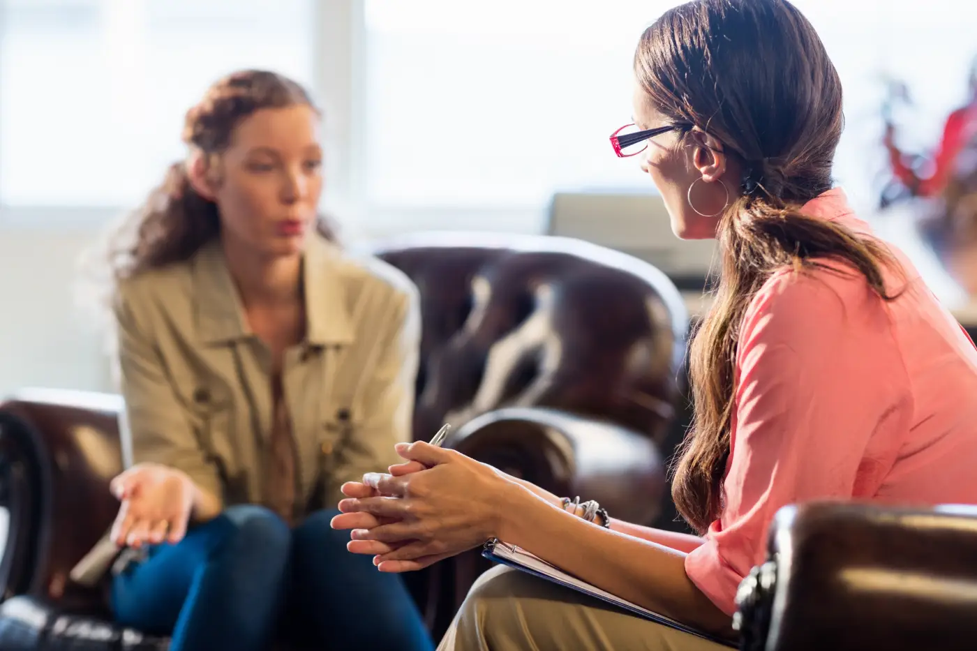 Women talking intently in counselling session